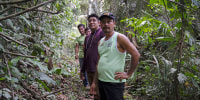 Residents of Puerto Franco, a Kichwa community, walk near the edge of the Cordillera Azul National Park in Peru's Amazon on Oct. 3, 2022.