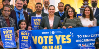 Aisha Wahab, center,  with supporters following a news conference where she proposed SB 403, in Sacramento, Calif.