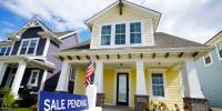 A "sale pending" sign is posted on.a home in Westfield, Ind., Friday, Sept. 25, 2020. Sales of new homes remained steady in October at a seasonally adjusted rate of 999,000 units. While the Commerce Department said October new home sales were down 0.3% from September, the government revised up its September figure marginally.