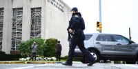 A police officer works at the scene of the Tree of Life Synagogue shooting in Pittsburgh