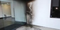 Burn marks on the exterior of the Planned Parenthood clinic in Costa Mesa, Calif., on March 13, 2022.