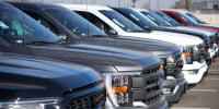 Unsold 2022 F-150 pickup trucks at a Ford dealership in southeast Denver. 