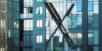 A partially completed "X" sign rests atop the company headquarters, formerly known as Twitter, in downtown San Francisco, on Friday, July 28, 2023. San Francisco has launched an investigation into the sign as city officials say replacing letters or symbols on buildings, or erecting a sign on top of one, requires a permit. (AP Photo/Noah Berger)
