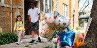 Neighbors pass by a memorial for an 8 year-old girl shot and killed outside of her Portage Park apartment in Chicago on Monday, Aug. 7, 2023.