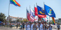 Color Guard members from the U.S. Navy and U.S. Marine Corps march at the 2018 San Diego Pride Parade on July 14, 2018.  