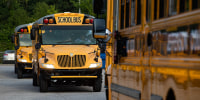 School buses packed with students on the first day of school on Wednesday, Aug. 9, 2023, Louisville, Ky.