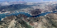 A bathtub ring of light minerals show the high water mark on the shore of Lake Mead along the border of Nevada and Arizona.