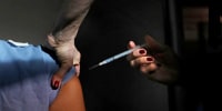 Close-up of a person receiving a Covid-19 vaccine