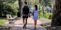 Image: People stroll through the space formerly known as Calhoun Square in Savannah, Ga., on Aug. 9, 2023. 