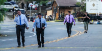 Image: Detectives walk at the scene of a mass shooting at Cook's Corner, on Aug. 24, 2023, in Trabuco Canyon, Calif.