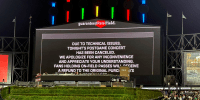 A message on the main scoreboard at Guaranteed Rate Field announces the cancellation of a '90s concert that was to feature Vanilla Ice, Tone Loc and Rob Base after a baseball game between the Chicago White Sox and the Oakland Athletics, Friday, Aug. 25, 2023, in Chicago.
