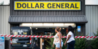 Image: People walk past the Dollar General store where three people were shot and killed the day before on Aug. 27, 2023 in Jacksonville, Fla.