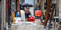 Record rainfall in Hong Kong caused widespread flooding in the early hours on September 8, disrupting road and rail traffic just days after the city dodged major damage from a super typhoon.