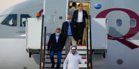 U.S. citizens, from left, Emad Sharqi and Morad Tahbaz Siamak Namazi disembark from a Qatari jet upon their arrival at the Doha International Airport on Sept. 18, 2023.