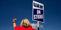 A United Auto Workers (UAW) member on a picket line outside the Ford Motor Co. Michigan Assembly plant in Wayne, Mich., on Sept. 15, 2023.