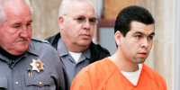 FILE - Anthony Sanchez, right, is escorted into a Cleveland County courtroom for a preliminary hearing, Feb. 23, 2005, in Norman, Okla. On Thursday, Sept. 21, 2023, Oklahoma plans to execute Sanchez for the 1996 slaying of a University of Oklahoma dance student in a case that went unsolved for years. Sanchez, 44, is scheduled to receive a lethal injection at 10 a.m. at the Oklahoma State Penitentiary in McAlester, Okla.