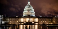 People walk along the east front plaza of the US Capitol as night falls on December 17, 2019 in Washington, DC. The House Rules Committee is holding a full committee hearing to set guidelines for the upcoming debate and vote on the two Articles of Impeachment of President Trump in the House of Representatives.