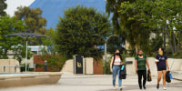 People walk on the California State University Long Beach  campus in 2021.