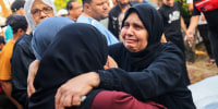 People mourn during the funeral of members of the Saqallah family  in Khan Yunis, Gaza.