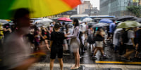 Participants take part in a Pride parade as part of the Seoul Queer Culture Festival in Seoul on July 16, 2022. 