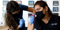 A registered nurse administers a dose Covid-19 vaccine in St. Petersburg, Fla, on Aug. 6, 2021.