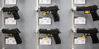 Handguns displayed at a booth during the National Rifle Association annual convention in 2023.