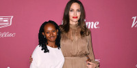 Zahara Jolie-Pitt and Angelina Jolie pose at the step-and-repeat of the Variety's Power Of Women