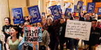 People rally for transgender rights outside of the Senate chamber in Indianapolis.