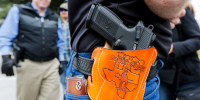People wear their guns at an open carry rally in Texas.