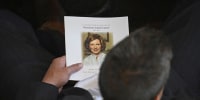 An attendee holds a program prior to a tribute service for former first lady Rosalynn Carter at Glenn Memorial Church in Atlanta on Nov. 28, 2023.