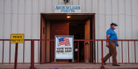 A man walks out after casting his vote at the American Legion in Tombstone, Cochise County, Ariz.,  on Nov. 3, 2020. 
