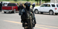 A member of the Civil Guard at a checkpoint at the entrance of Apatzingan, Mexico,