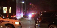 Police lights and caution tape can be seen as officers work at the scene of a recovered FBI vehicle following a carjacking in Washington, D.C.