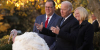 WASHINGTON, DC - NOVEMBER 19: Accompanied by Chairman of National Turkey Federation Phil Seger (L) and turkey grower Andrea Welp (R), U.S. President Joe Biden participates in the 74th annual Thanksgiving turkey pardon of Peanut Butter in the Rose Garden of the White House November 19, 2021 in Washington, DC. 