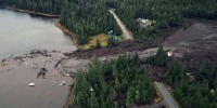 Image: An aerial view of mud and forest debris that buried a stretch of the Zimovia Highway a day after a landslide struck an area of Wrangell, Alaska