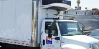 Exclusive Poultry truck outside the building.