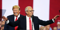 Donald Trump smiles as Kevin Cramer speaks to supporters during a campaign rally in Fargo in 2018.