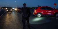 Del Rio Police direct cars waiting at the US-Mexico border at the Del Rio International Bridge to leave after the bridge was closed temporarily after an influx of migrants, in Del Rio, Texas in 2021. 