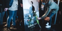 Relatives and colleagues gather around a portrait of Samuel Paty.