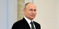 Russian President Vladimir Putin leaves after delivering his speech.