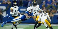 Indianapolis Colts wide receiver Michael Pittman Jr. catches a pass before being hit by Pittsburgh Steelers safety Damontae Kazee