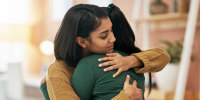 Cropped shot of two young women embracing each other
