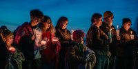 Community members gather at a candlelight vigil at Wiese Park to reflect and mourn the shooting at the Perry Middle School and High School complex on Jan. 4, 2024 in Perry, Iowa.