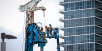 Construction workers on the site of a new residential building on Jan. 5, 2024 in Miami.