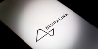The Neuralink logo on a smartphone screen.