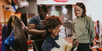 The women who teach white adoptive parents of black children how to do hair