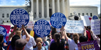 Demonstrators rally in support of abortion rights.