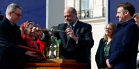 French President Emmanuel Macron, right, and Justice Minister Eric Dupond-Moretti, center, take part in a ceremony to seal the right to abortion in the French Constitution in Paris