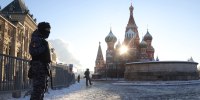 Russian National Guard Service offcers guard the Red Square near the Saint Basile's Cathedral in Moscow