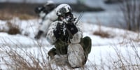A Swedish soldier takes part in an amphibious assault in Badderen, Norway, during a NATO exercise.